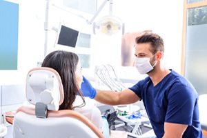 Dentist examining patient's smile