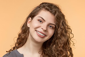 Young woman with tooth-colored braces