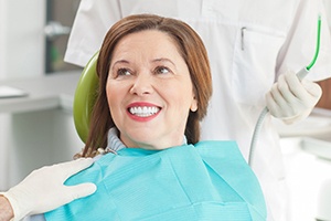 Smiling senior woman in dental chair