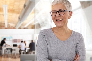 older woman smiling with dental implants in Michigan City