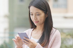 Woman researching on her phone