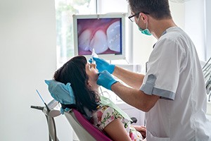 Dentist checking patient’s teeth in Michigan City 