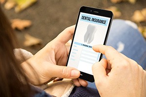 Patient checking their dental insurance on their phone