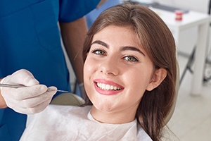 Woman receiving oral cancer screening