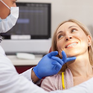 woman in dental chair smiling