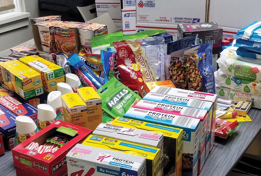 Person loading canned goods