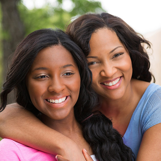 Smiling mother and daughter