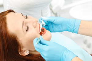 Woman receiving dental treatment