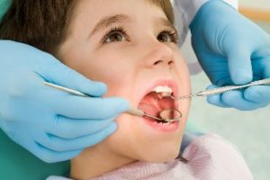 Child getting a dental exam