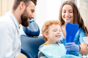 Young boy in dental chair at children’s dentist.