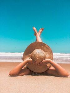 Woman laying on the beach