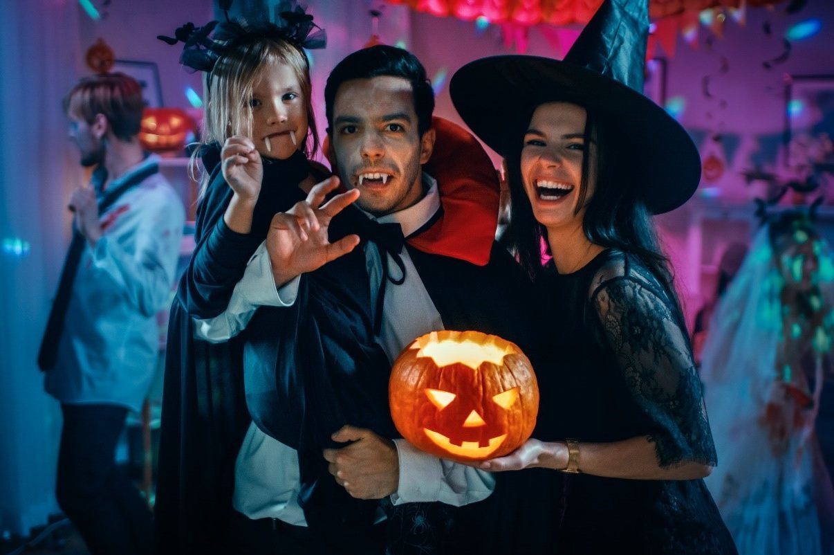 family dressed in Halloween costumes