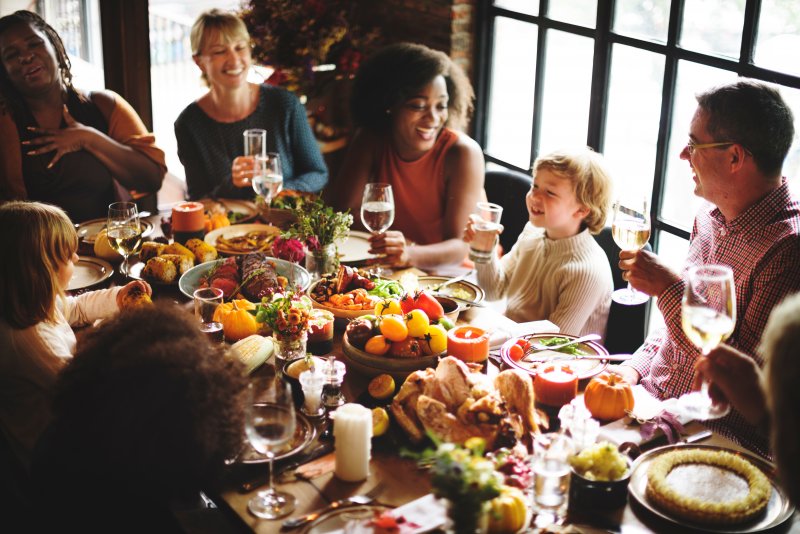 A picture of a happy family having Thanksgiving dinner