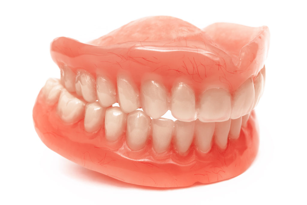 Full removable denture set of the jaws on white background